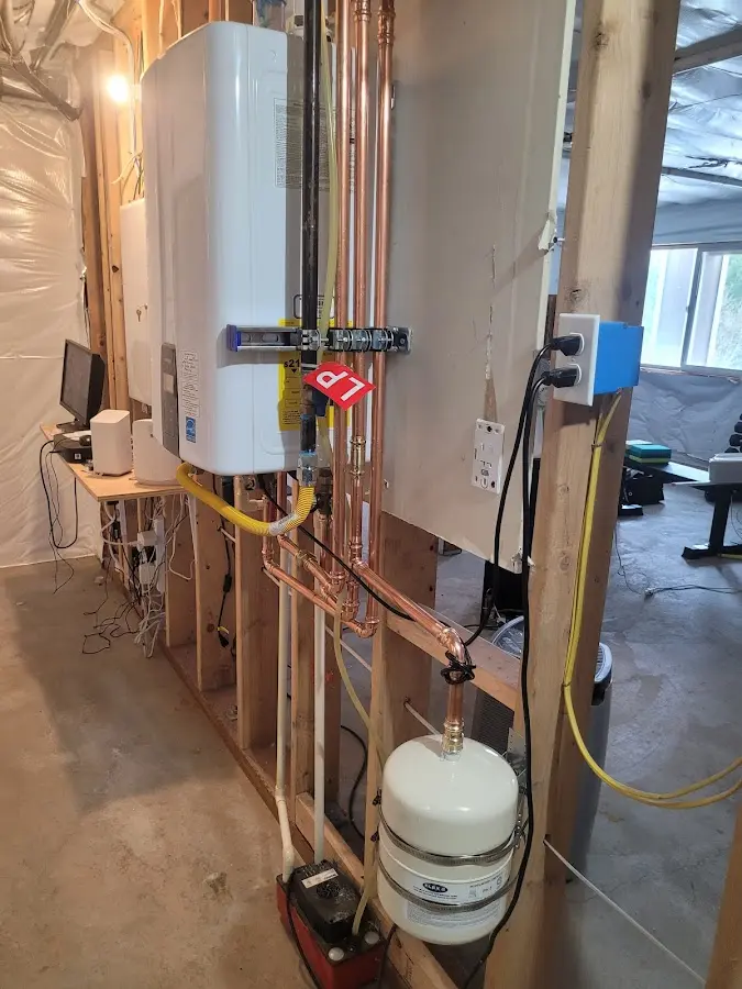 Licensed plumber repairing a kitchen sink in Hooksett